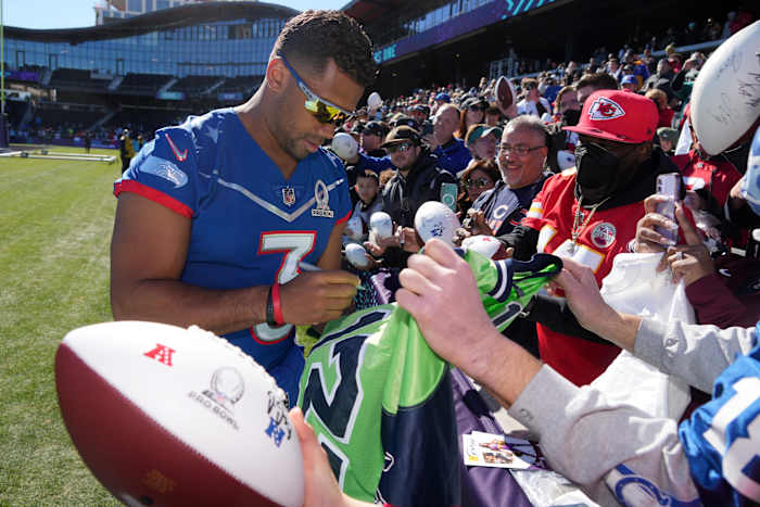 Feb 4, 2022; Las Vegas, NV, USA; Seattle Seahawks quarterback Russell Wilson (3) signs autographs for fans during NFC practice at the Las Vegas Ballpark. Mandatory Credit: Kirby Lee-USA TODAY Sports